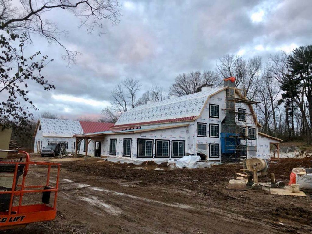 under construction photo showing SIP installation with weather barrier applied