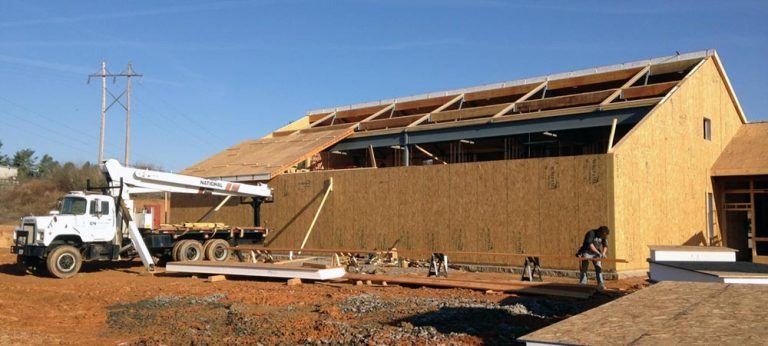 construction site installing structural insulated panels