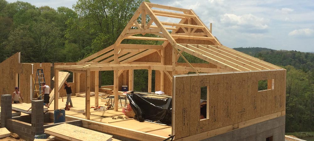 structural insulated wall installation on timberframe