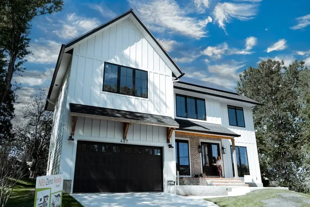 Completed DOE Zero Energy Ready SIP home exterior in Vienna, Virginia with a Net Zero Ready yard sign